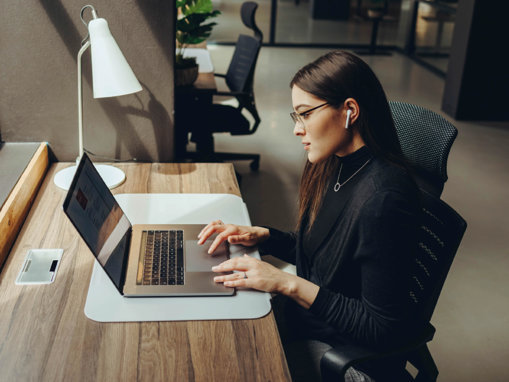 Solo attorney building recurring revenue in her law firm in 2026 using laptop and modern tools